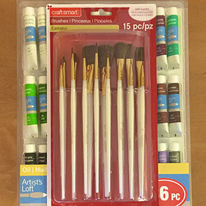 paintbrushes and paint in package