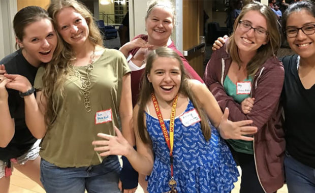 Students smiling in group photo