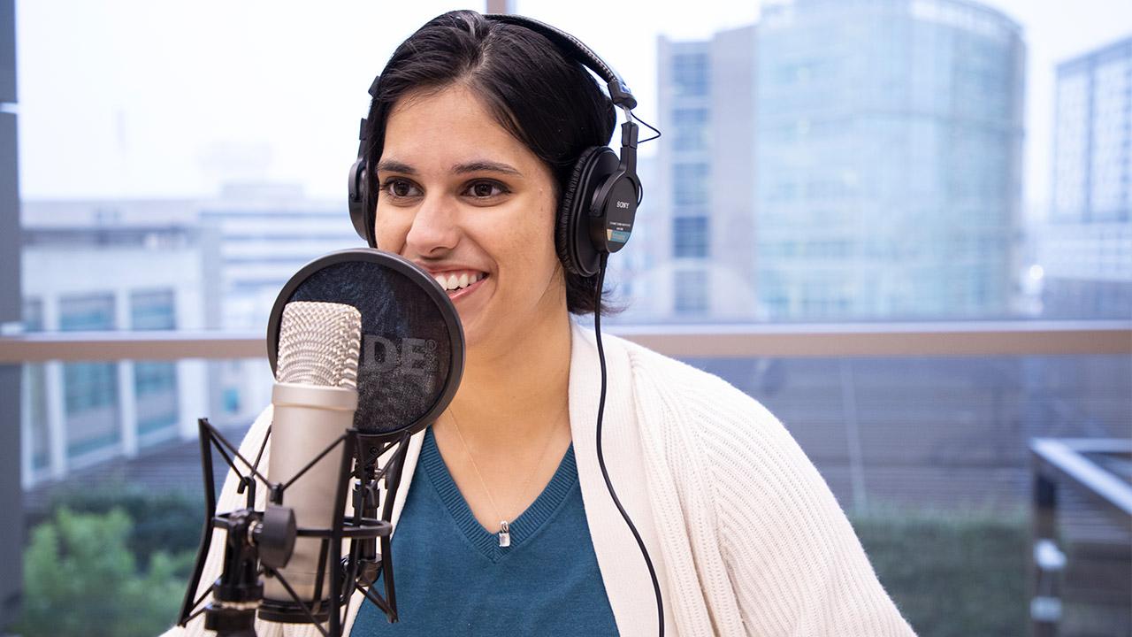 Ritika Bhattacharjee making a podcast.