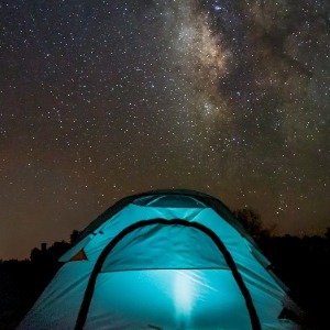 camping tent under the starry night sky