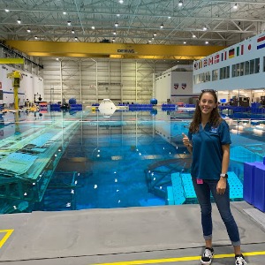 Student, Leah Davis, in front of one of the NASA test diving pools