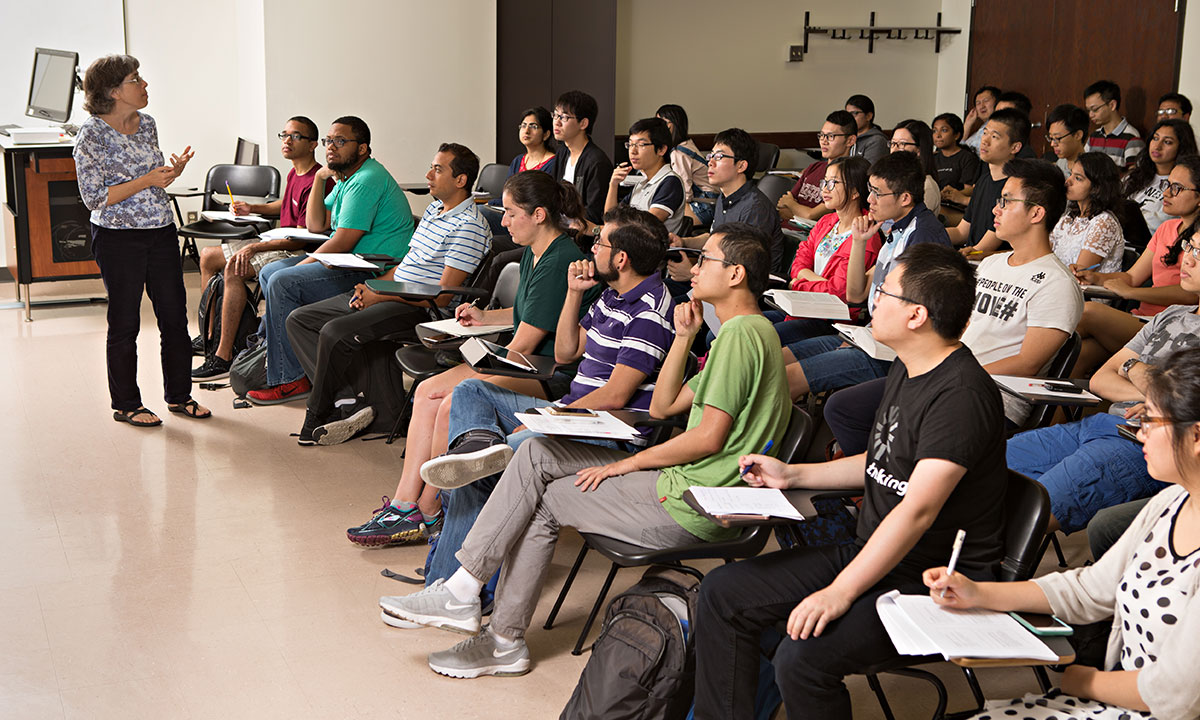 classroom of students listening to a professor