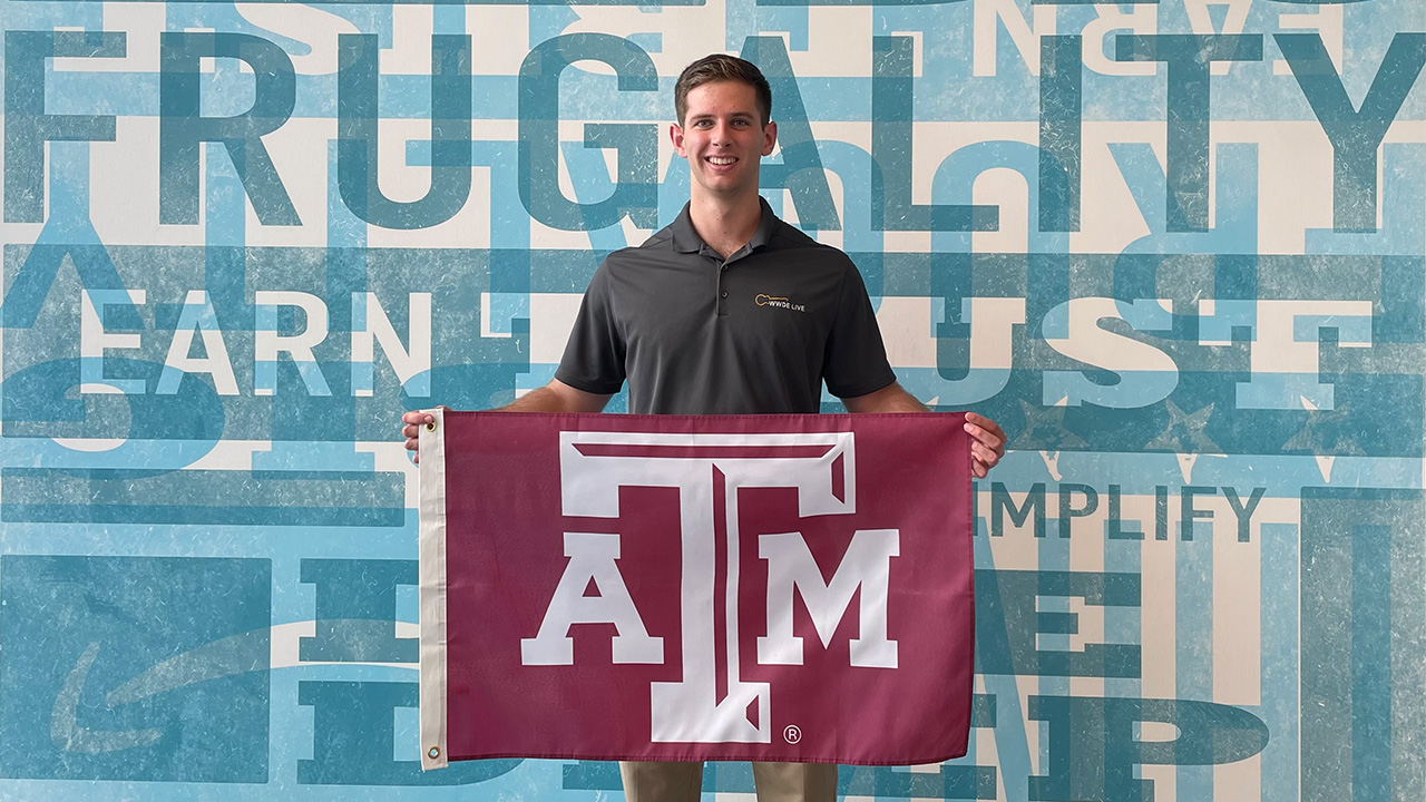 Austin Kees holding a Texas A&M flag