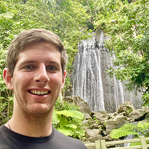 Austin Kees in front of a waterfall