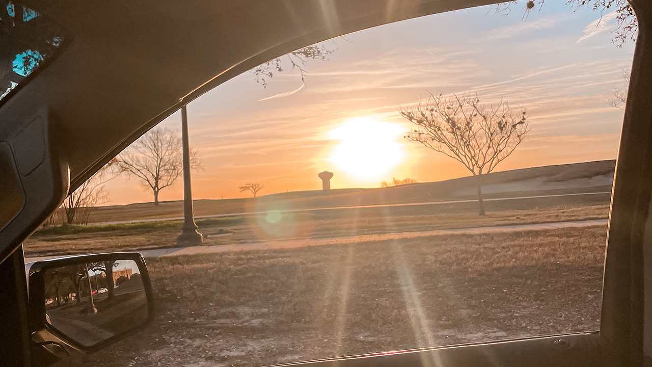 Sunset view through a car window
